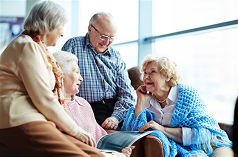 Older people sitting around talking