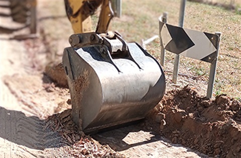 Machinery digging a drainage channel