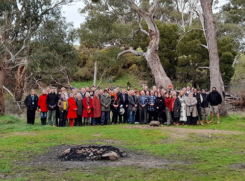 Around 50 people standing on the banks of Larni Barramal Yaluk in Franklinford