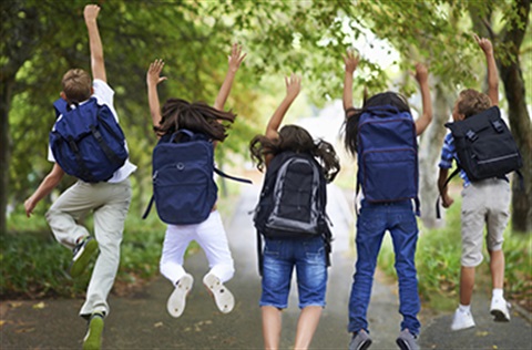 School holidays and children jumping in the air with excitement