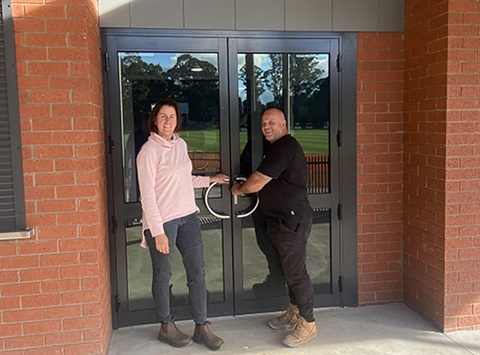 Elizabeth Atkins Project Manager with Craig Dovestan President Committee of Management at the front doors of the pavilion