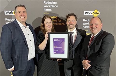 Bradley Catherine John and David hold the Award