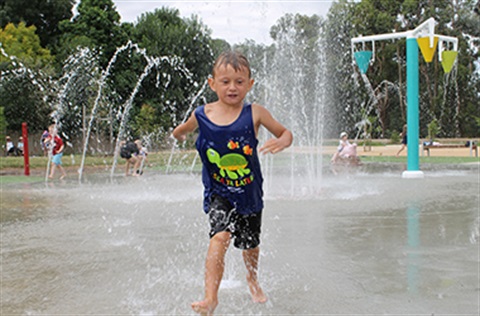 Child running through water at the Creswick Splash Park